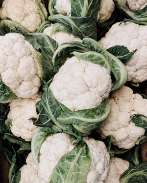 A pile of early snowball cauliflower heads